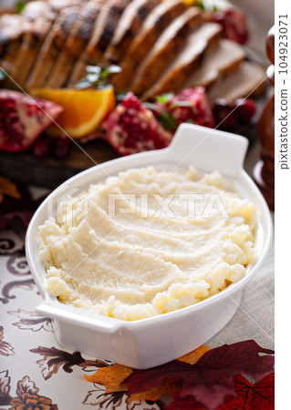 Mashed potatoes on Thanksgiving or Christmas table Mashed potatoes on Thanksgiving or Christmas table 104923071