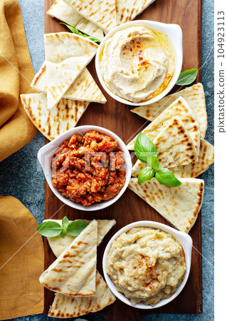 Mezze board with pita and dips 104923113