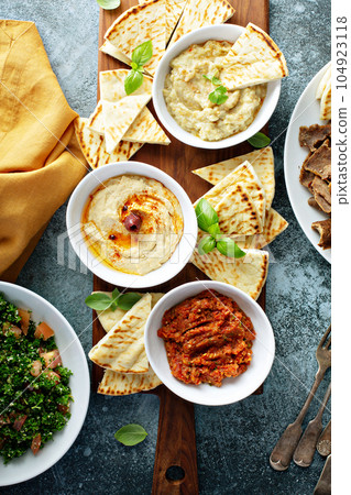 Mezze board with pita and dips 104923118