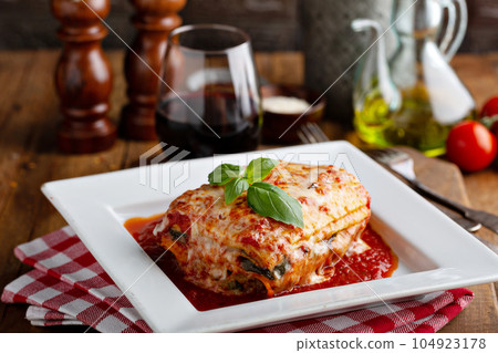 Classic lasagne piece on a plate 104923178