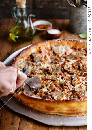 Deep dish meat pizza 104923184