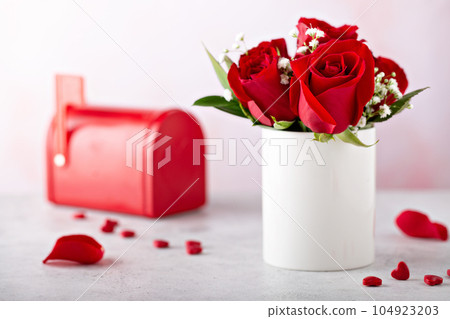 Red roses and hearts for Valentines day 104923203