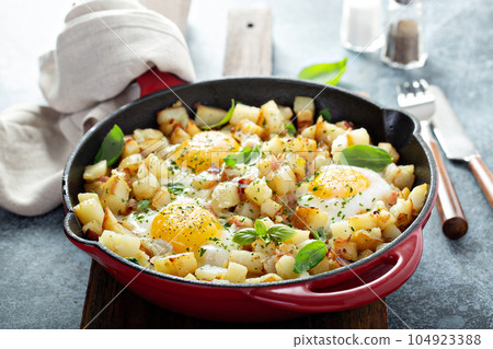 Potato hash with ham and eggs Potato hash with ham and eggs 104923388
