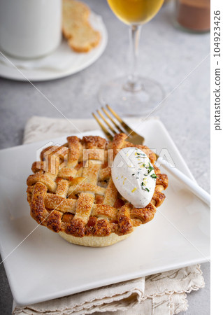 Festive Thankgiving dinner table with plates of food 104923426