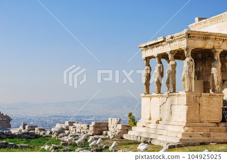 The Erechtheion or Temple of Athena Polias in Athens Acropolis, Caryatides of the Porch of the Maidens of ancient Greek Ionic temple-telesterion 104925025