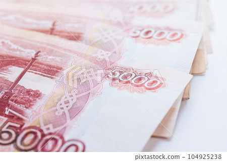 Five thousand ruble notes stacked, closeup Five thousand ruble notes stacked, closeup 104925238