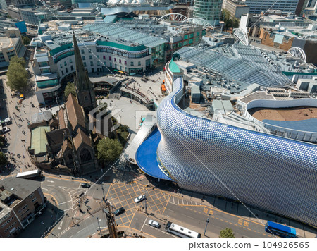 View of the skyline of Birmingham, UK including The church of St Martin, the Bullring shopping centre and the outdoor market. 104926565