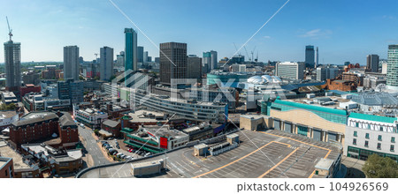 View of the skyline of Birmingham, UK including The church of St Martin, the Bullring shopping centre and the outdoor market. 104926569