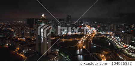 Aerial view of the Istambul business district. Rapidly developing business and finance area of Istanbul with highrises and shopping malls. Commercial buildings at night 104926582