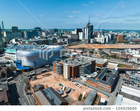 View of the skyline of Birmingham, UK including The church of St Martin, the Bullring shopping centre and the outdoor market. 104926600