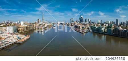 Aerial view of the Tower Bridge in London. One of London's most famous bridges and must-see landmarks in London. Beautiful panorama of London Tower Bridge. Aerial view of the Tower Bridge in London. One of London's most famous bridges and must-see landmarks in London. Beautiful panorama of London Tower Bridge. 104926638