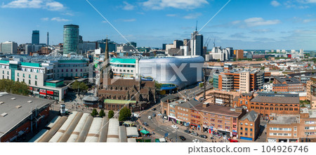 View of the skyline of Birmingham, UK including The church of St Martin, the Bullring shopping centre and the outdoor market. 104926746