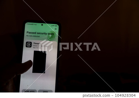 a hand holding a smatphone displaying Thread Application of Instagram to open after instalation. a hand holding a smatphone displaying Thread Application of Instagram to open after instalation. 104928304