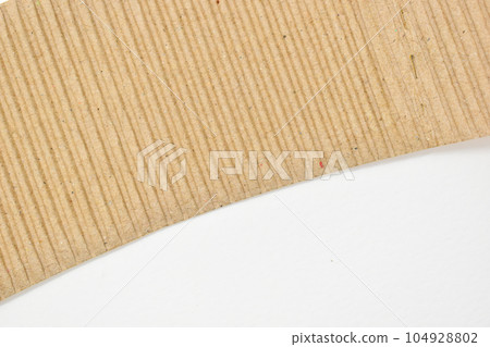closeup brown paper cardboard texture on white background closeup brown paper cardboard texture on white background 104928802