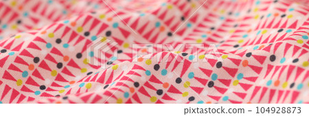 Wavy multicolored fabric with geometric ornament as background. Wavy multicolored fabric with geometric ornament as background. 104928873