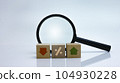 Financial concept to analysing business progress with magnifying glass on background. 104930228