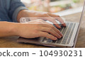 Man hand typing on laptop to searching information in search engine toolbox 104930231