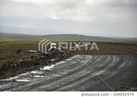 Motorhomes on a gravel road in Iceland on a cloudy day Motorhomes on a gravel road in Iceland on a cloudy day 104932474