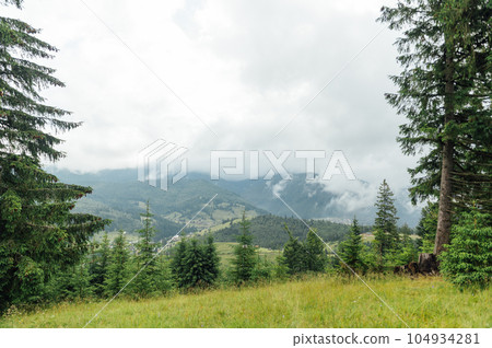 Green Ukrainian mountains. Summer time. Beautiful views of the largest peaks. 104934281