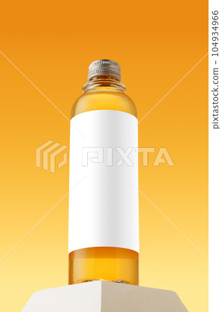 Bottle with skincare oil against yellow background 104934966