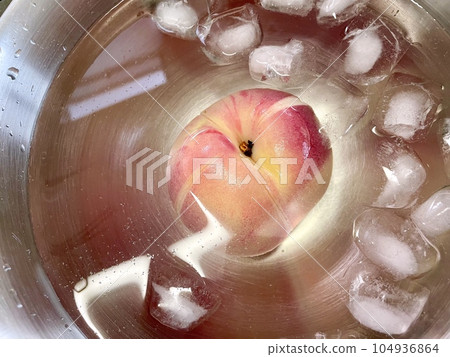 Peach peeled in hot water Peach peeled in hot water 104936864
