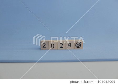 Abstract for business targen in the year 2024. Blue background. 104938905