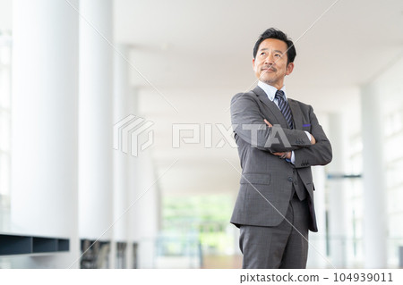 Manager middle-aged businessman working in the office Manager middle-aged businessman working in the office 104939011