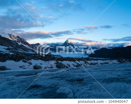 Zermatt, Switzerland - July 2nd 2023: Early morning view from a glacier towards the peak of Matterhorn 104940047