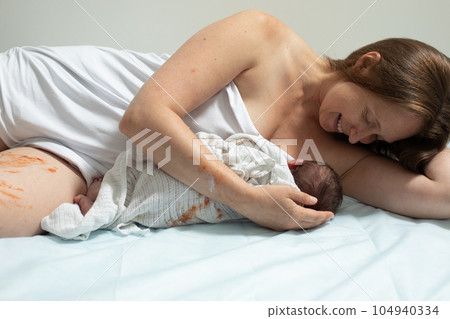 Woman with new born baby have a rest Woman with new born baby have a rest 104940334