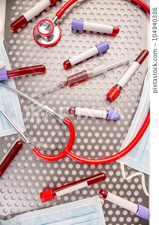 Blood sample along with syringe 104940386