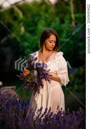 Woman with lavender wreath and whitre dress Woman with lavender wreath and whitre dress 104940402