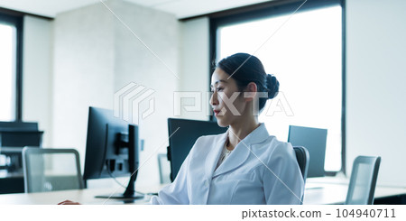 A lady in white 104940711