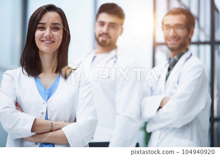 Attractive female doctor in front of medical stuff in hospital 104940920