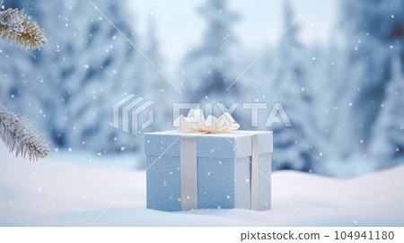 Christmas holiday gift and present, gift box in the snow in snowfall winter countryside nature for boxing day, holidays shopping sale 104941180