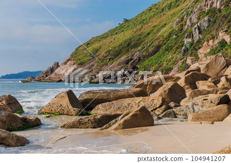Beach with rocks and sea. Praia do Rio das Pacas in Brazil 104941207