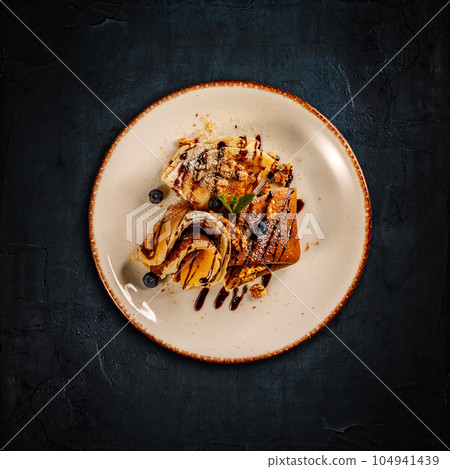 Crepes with chocolate cream 104941439