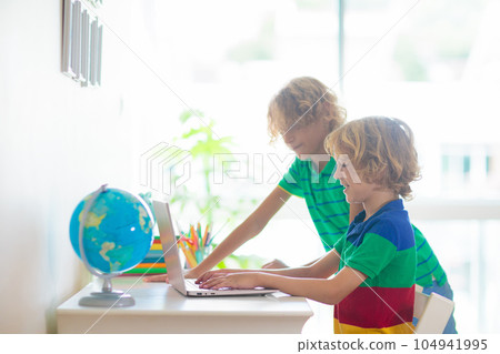 Online remote learning. School kids with computer. 104941995