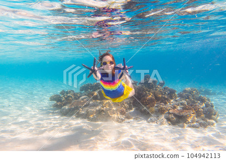 Child snorkeling. Kids underwater. Beach and sea. 104942113