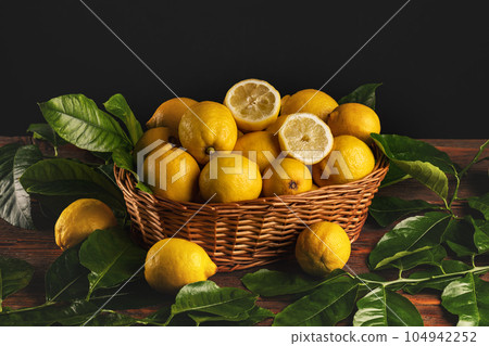 Basket of fresh lemons Basket of fresh lemons 104942252