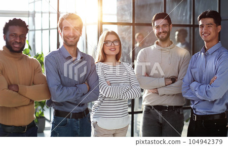 Portrait of business people in casual clothes standing with their arms crossed Portrait of business people in casual clothes standing with their arms crossed 104942379