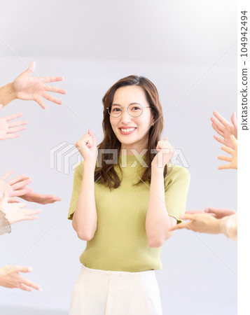 Young woman showing a proud expression after being praised 104942494