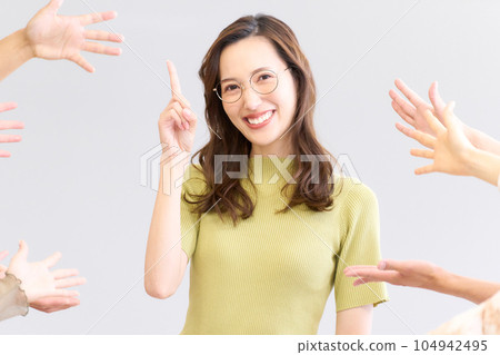 Young woman showing a proud expression after being praised 104942495