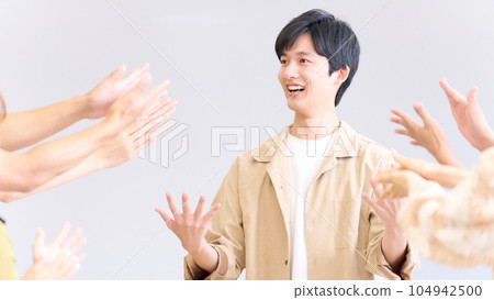 Young man showing a proud expression after being praised Young man showing a proud expression after being praised 104942500