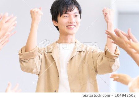 Young man showing a proud expression after being praised Young man showing a proud expression after being praised 104942502