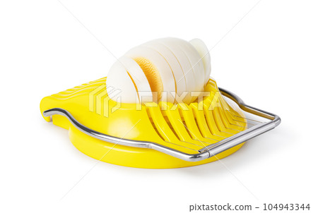 Boiled egg in the egg slicer. Boiled egg in the egg slicer. 104943344