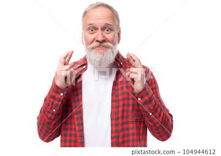 joyful lucky 60s retired man with white beard and mustache in red shirt 104944612