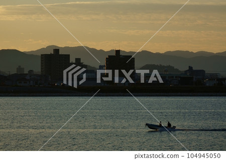 River reflecting morning sky and fishing boat・Winter・221210am 104945050