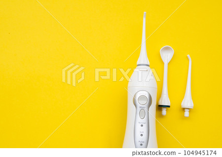 Mouth aerator on a yellow background with different nozzles. View from above Mouth aerator on a yellow background with different nozzles. View from above 104945174