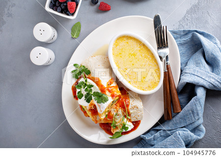 Breakfast egg burrito with grits 104945776