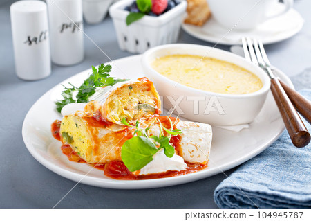 Breakfast egg burrito with grits 104945787